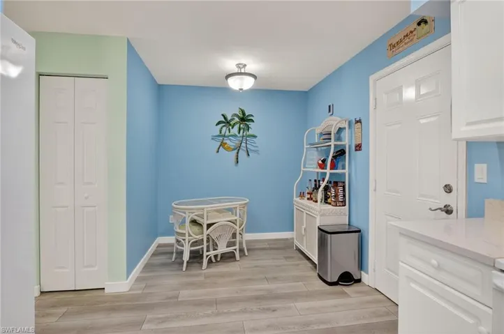 Dining space featuring light wood-style floors and baseboards