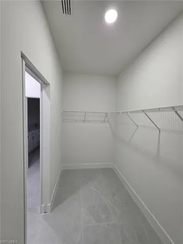 Spacious closet with visible vents