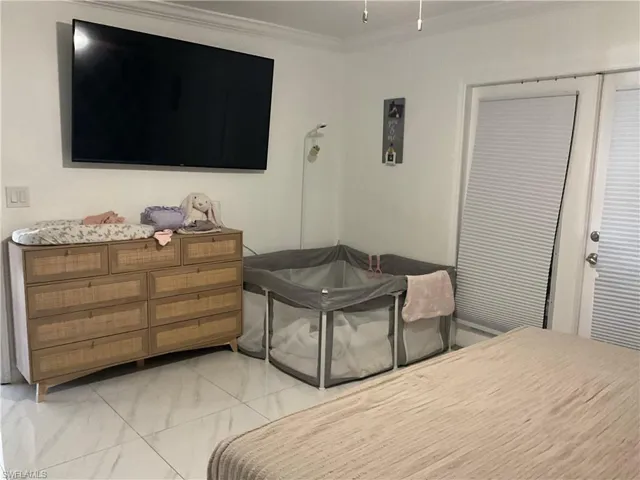 Bedroom with crown molding