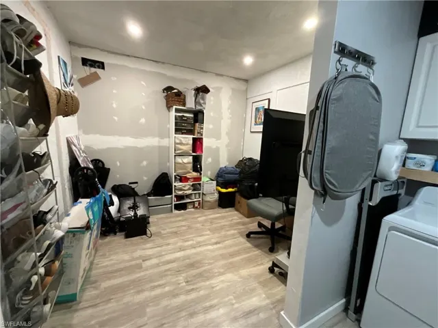 Laundry room featuring washer / clothes dryer, light wood-style floors, recessed lighting, and an office area