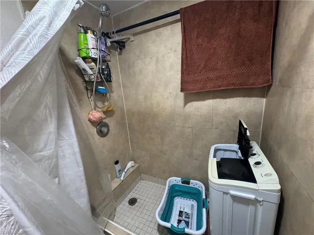 Full bath featuring a stall shower