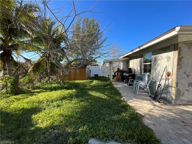 Fenced backyard with a shed