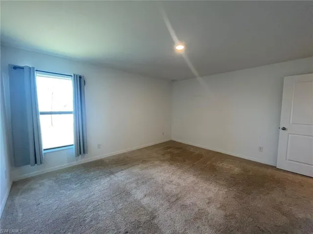 View of carpeted spare room