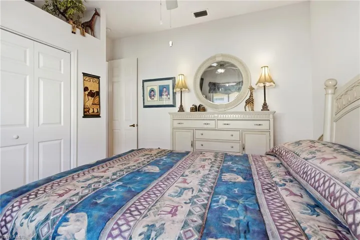 Bedroom featuring a ceiling fan and a closet