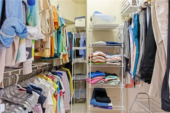 View of spacious primary closet