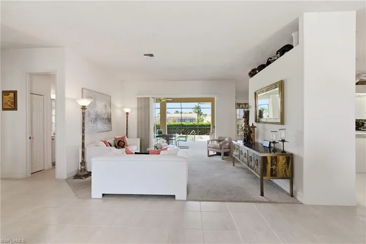 Carpeted living room with great view of the golf course