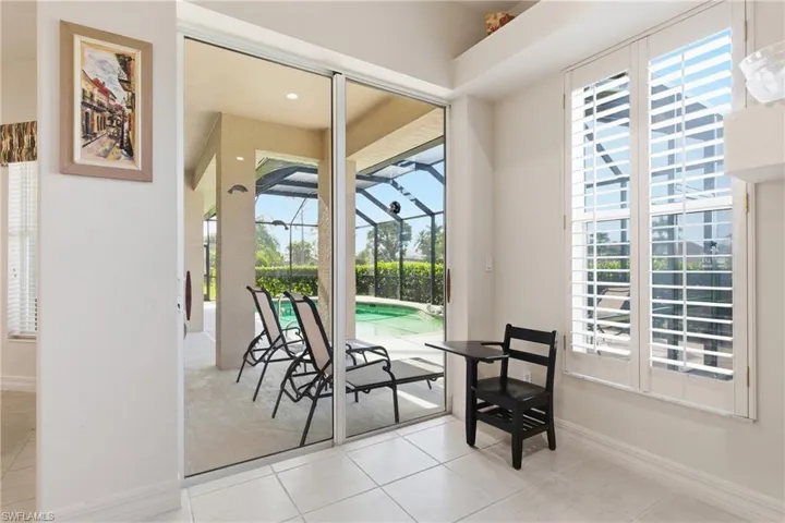 Breakfast area features plantation shutters and easy access to the lanai.