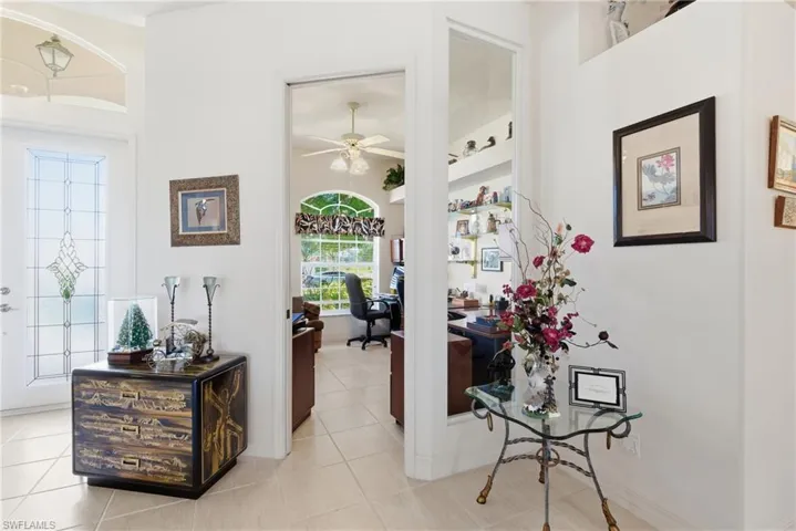 The den/Office features large window with a view to the pool and lanai.