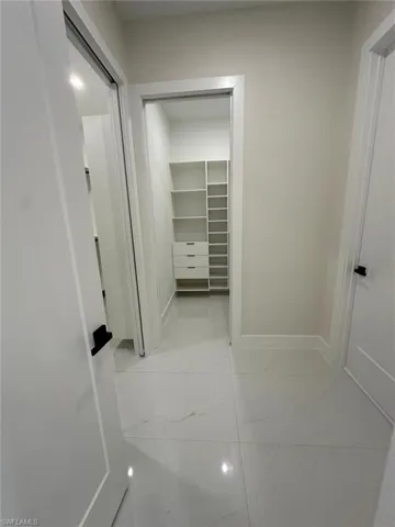 Hallway to 2 Walk-in Closet and Master Bathroom