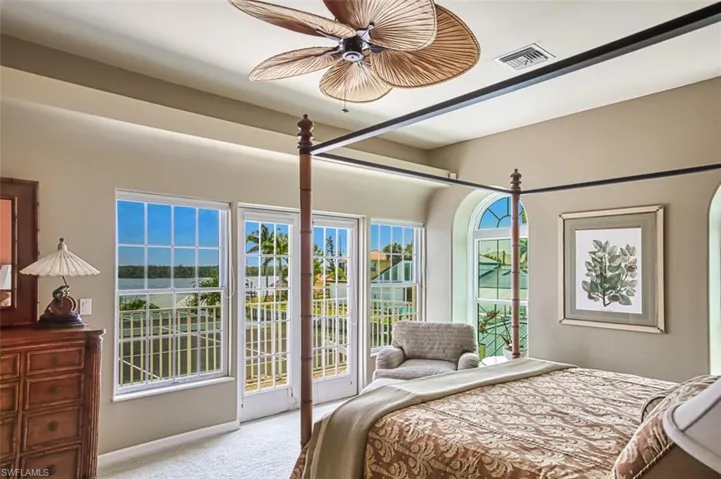 Upstairs Primary Suite - Doors open to balcony