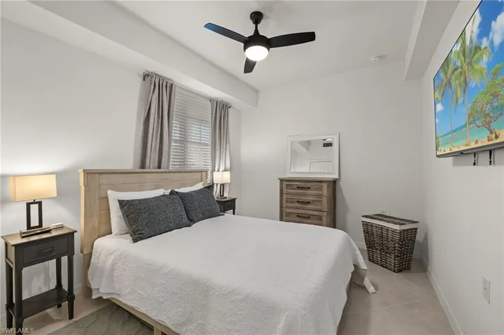 Tiled bedroom with ceiling fan