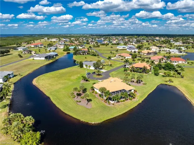 Aerial view of residential area with a large body of water