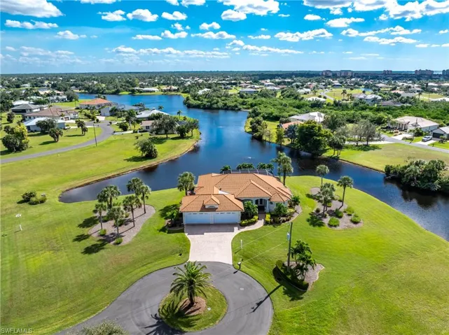 Aerial view of residential area with a nearby body of water