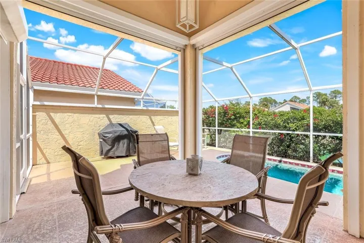 View of patio / terrace featuring area for grilling, a lanai, and an outdoor pool