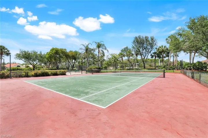 View of sport court featuring fence