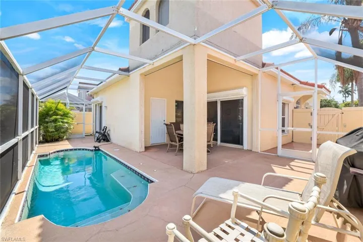 View of pool with a fenced in pool, a lanai, a patio, and fence
