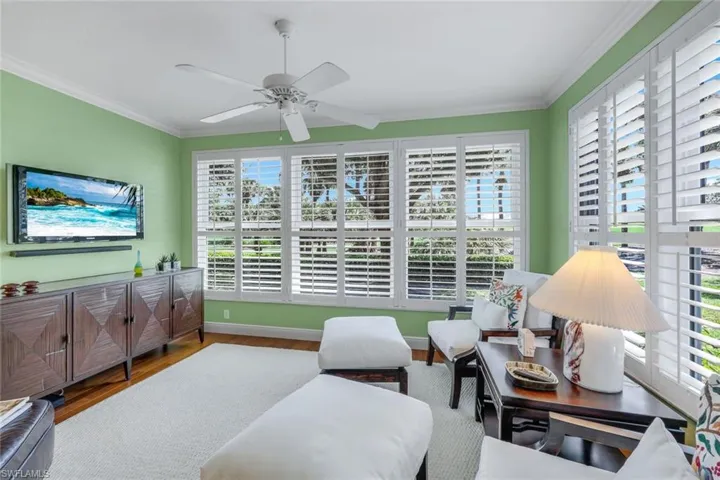 Sunlit room doubles as TV room, office or both! Lush fairway golf course views with putting green in the distance. Owner will leave wall TV if desired.