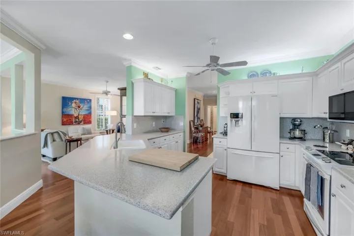 Updated kitchen has counter height breakfast bar and extended dining room cabinets!