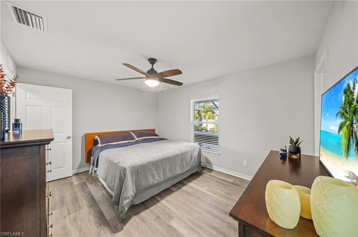 Bedroom featuring light wood-type flooring and a ceiling fan