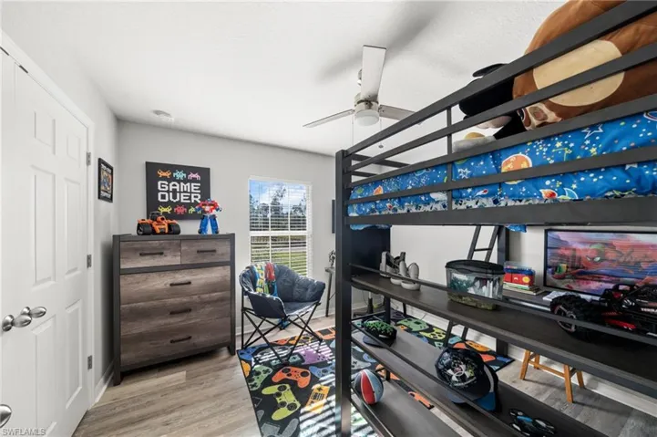Bedroom featuring light wood finished floors and ceiling fan