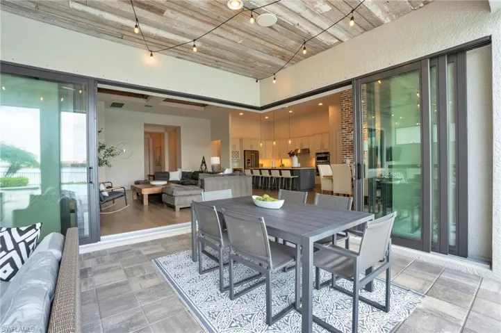 View from lanai with reclaimed on the ceiling, and zero corner sliding glass doors