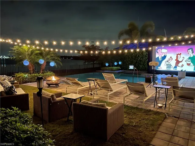 Patio terrace at night with with inflatable screen for movie night