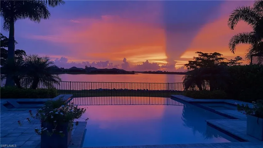 Pool at dusk with lake view
