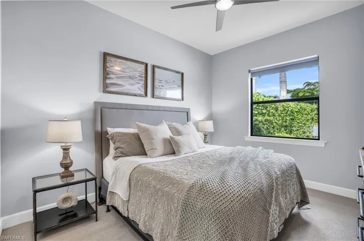 Bedroom 4 featuring carpet and ceiling fan