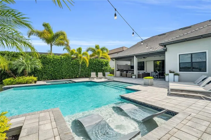 View of pool with outdoor lounge area and a patio area