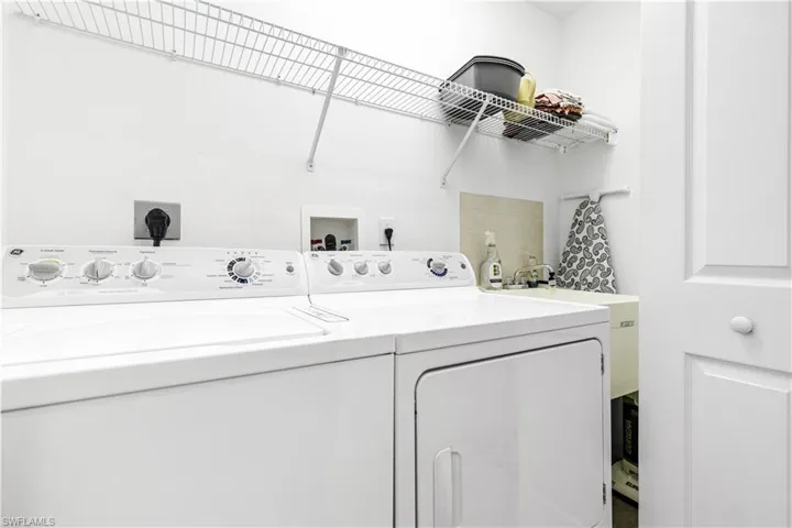 Washroom featuring washer and clothes dryer