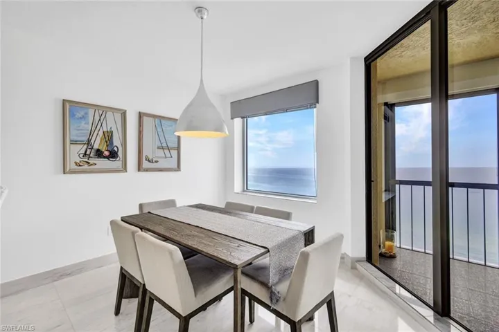 Dining area featuring light marble finish flooring