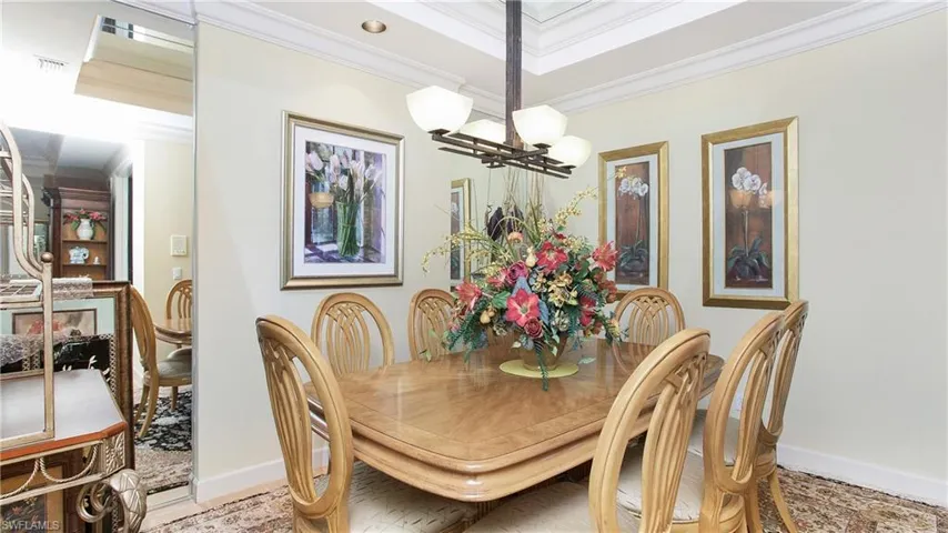 Dining room featuring an inviting chandelier and crown molding