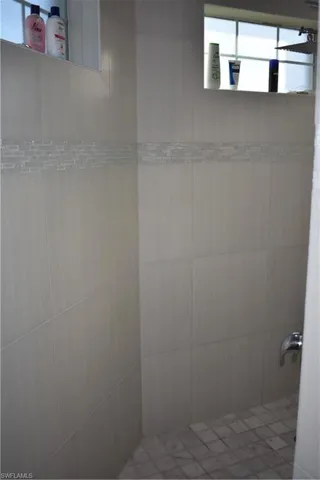 Bathroom featuring a tile shower