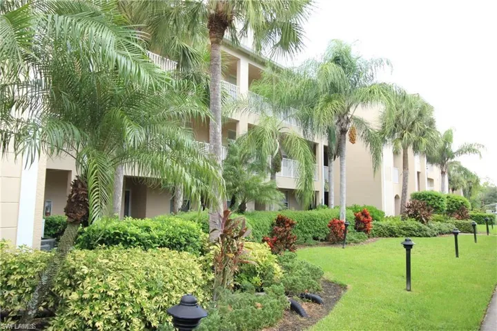 View of home's community with a yard