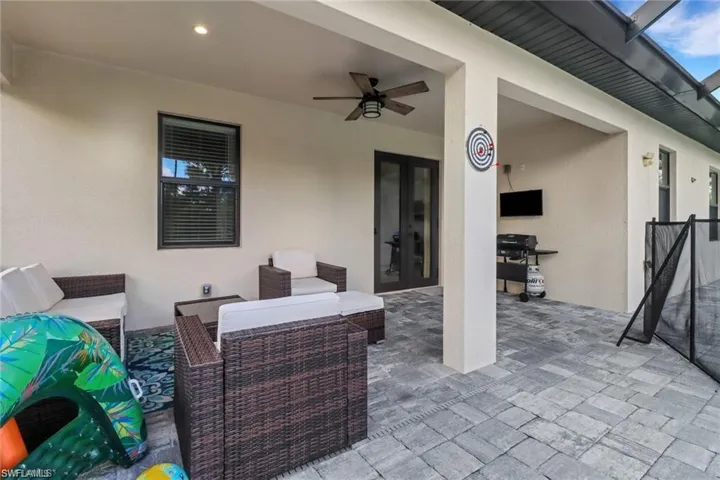 View of patio / terrace featuring ceiling fan, french doors, an outdoor hangout area, and area for grilling
