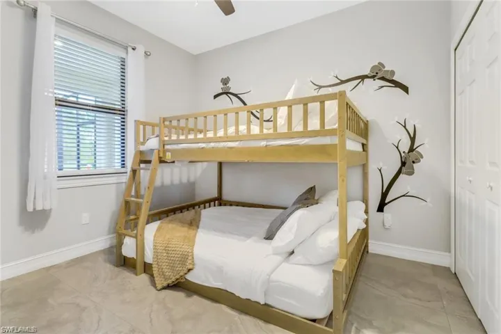 Bedroom featuring a closet and ceiling fan