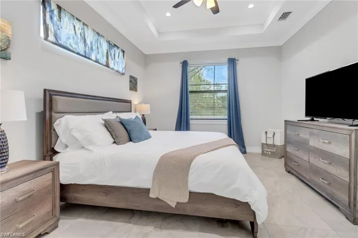 Bedroom with a ceiling fan, crown molding, and recessed lighting