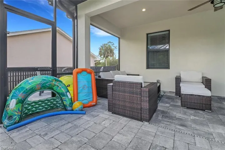 View of patio / terrace featuring a sunroom, an outdoor hangout area, a lanai, and ceiling fan