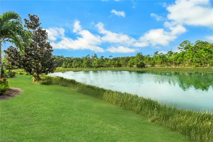 View of water feature featuring a view of trees