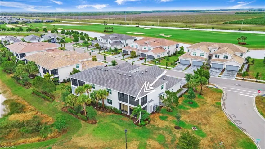 Two-story residence with a gray tile roof and white exterior siding