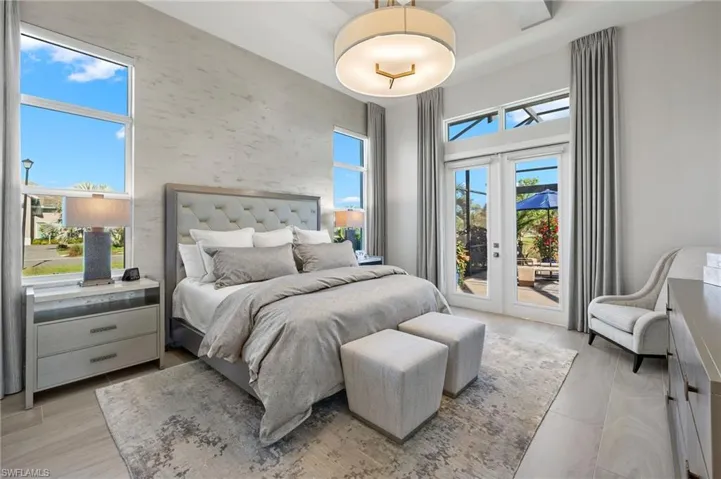 Bedroom with light hardwood / wood-style floors, access to exterior, and french doors