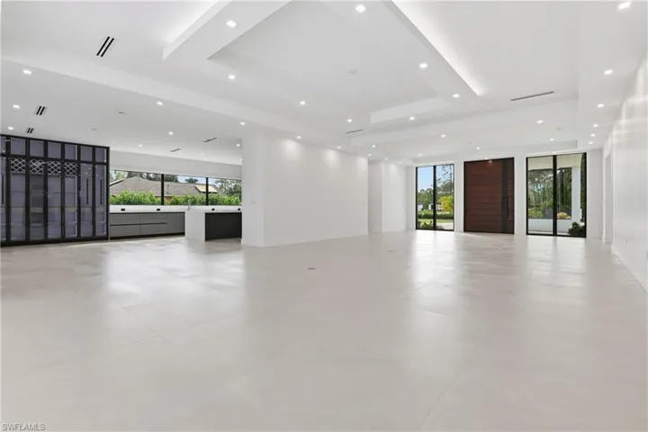 Unfurnished room featuring recessed lighting and a tray ceiling
