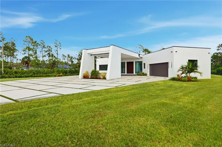 View of outdoor structure with concrete driveway