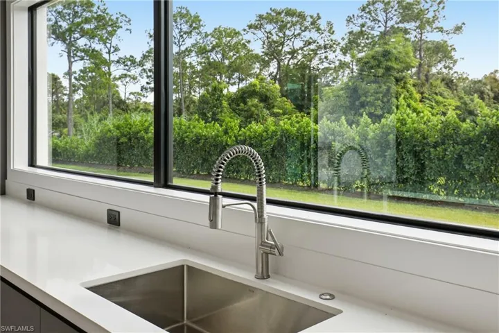 Kitchen view of light stone counters
