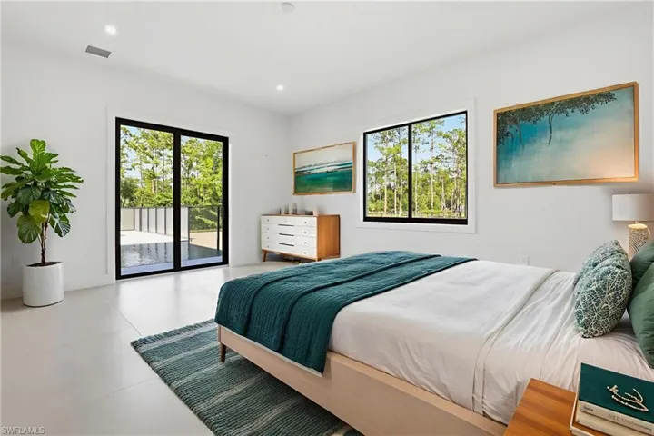 Bedroom featuring access to exterior and recessed lighting