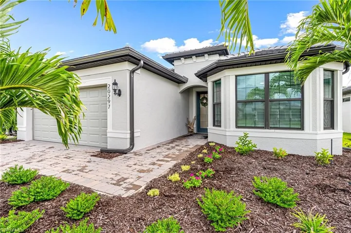 View of front of property featuring a garage