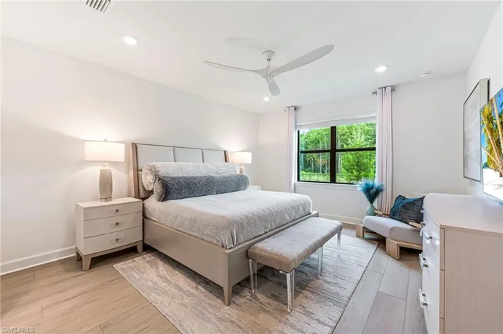 Bedroom with light wood-type flooring and ceiling fan