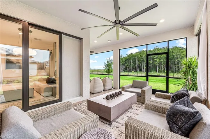 Sunroom featuring ceiling fan
