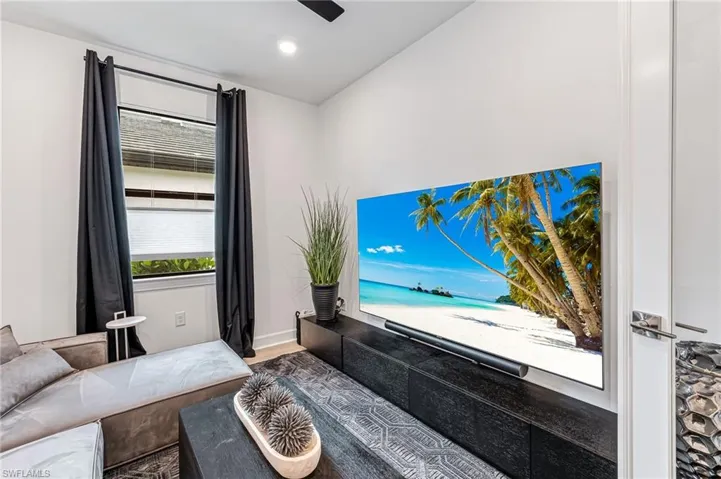 Living room with hardwood / wood-style flooring