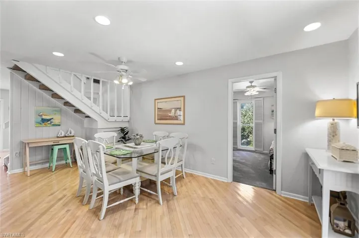 Dining room with ceiling fan, light wood-type flooring, and recessed lighting